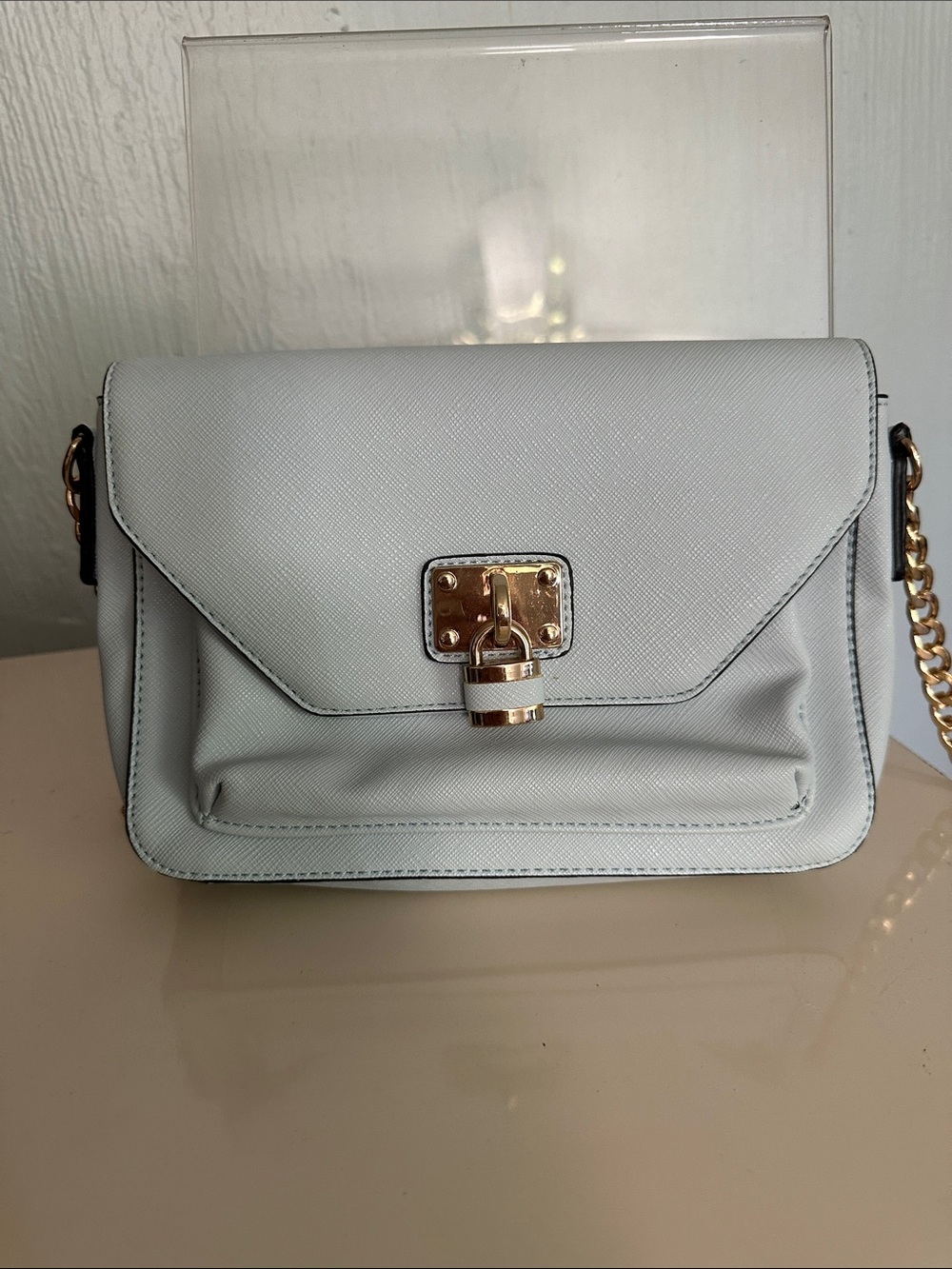 Light blue Chain-Handle Crossbody Bag with Gold Lock.